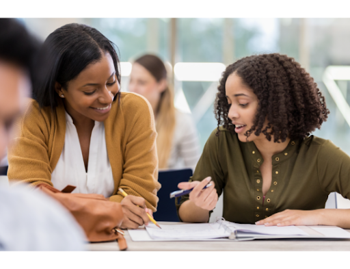 student and teacher discussing