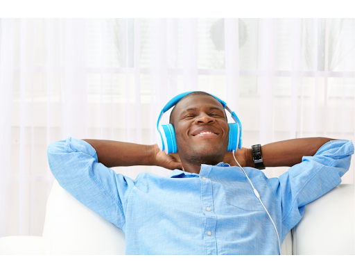 man relaxing thru music